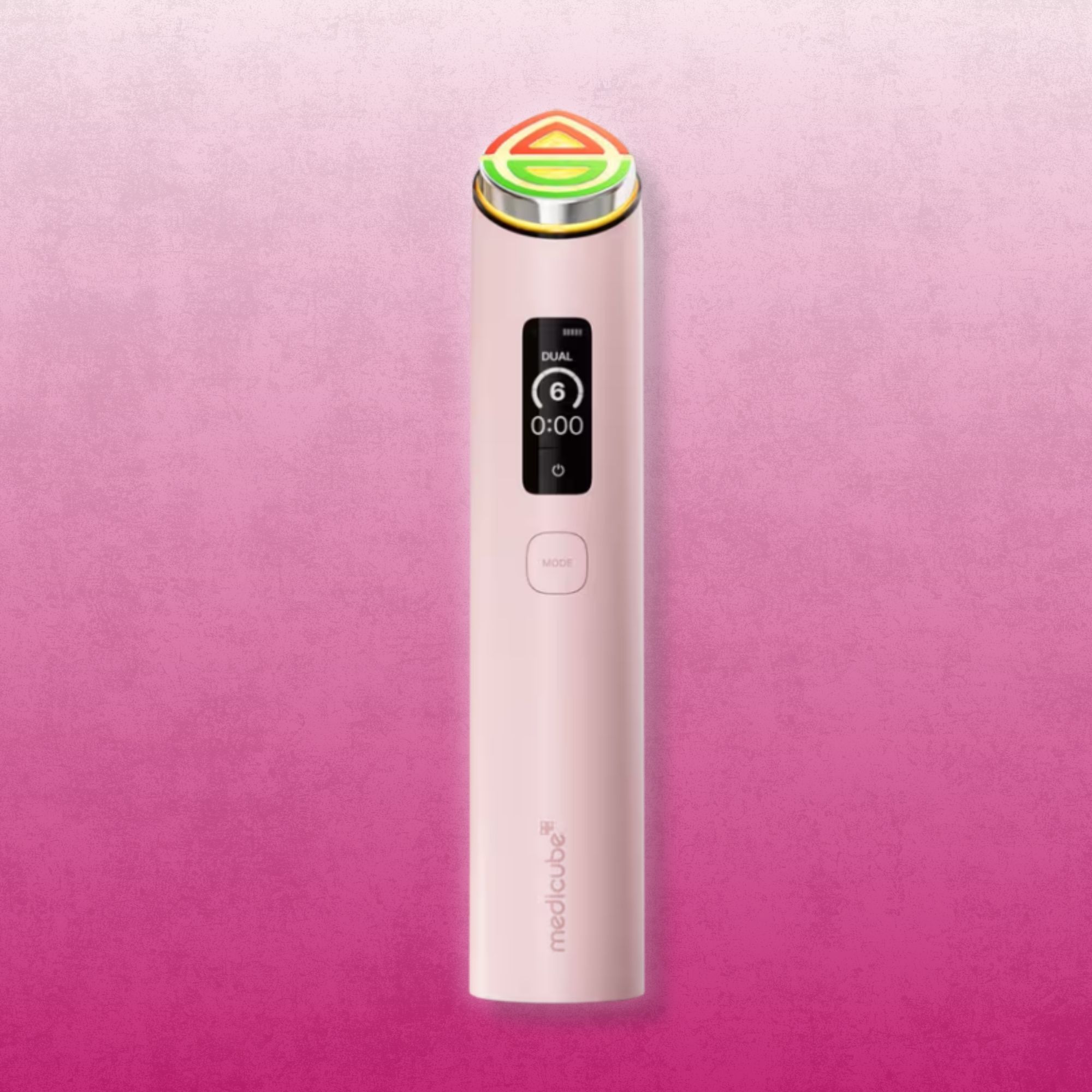 Pink medicube Booster Pro X2 facial device on a pink background.